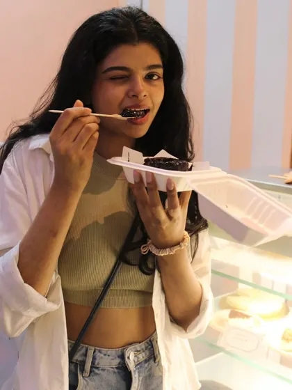 A customer enjoying every last bite of our viral Matilda Cake right here in our patisserie.