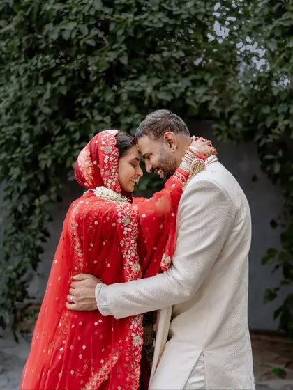 A beautiful moment between Vidushi and Avinash. For her North Indian wedding ceremony, she wore a classic red lehenga, and I created a timeless, radiant makeup look.