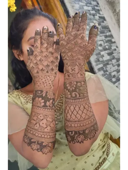 A duplicate image of the bride showing her full, intricate bridal mehendi.