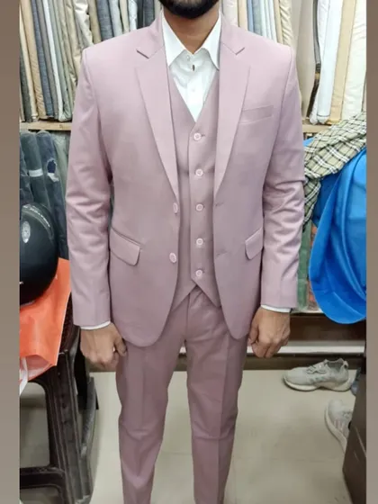 A client looking sharp in a dusty pink three-piece suit. I can tailor suits in contemporary colors for grooms and wedding guests.