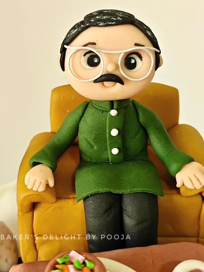 A close-up of the custom human figurine, designed to resemble the client's father. I even matched the color of his outfit to make it as personal as possible.