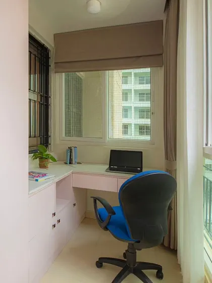 I converted a balcony into this chic study nook for two sisters. It features durable quartz countertops, ample storage, and large windows that fill the space with natural light.