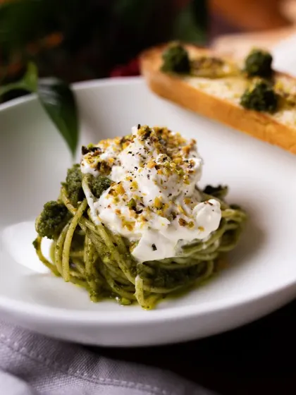 Our catering menu isn't just about pizza. We also offer delicious pasta dishes like this Pesto Spaghetti with Stracciatella.