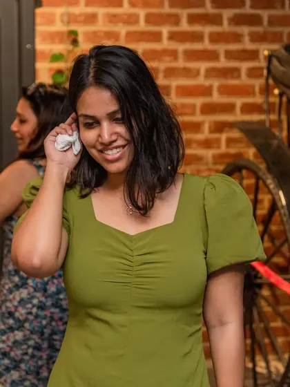 A candid moment of a guest enjoying the party near our famous carriage photo op.