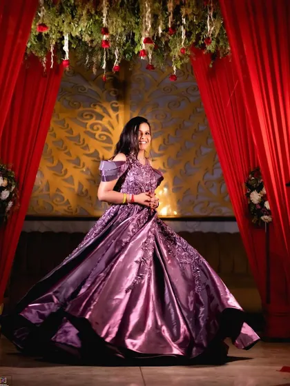 A stunning solo portrait of the bride-to-be, twirling in her magnificent purple engagement gown.