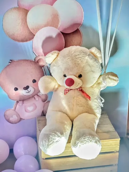 A detail shot of the teddy bear props used in a modern baby shower. The soft toys add a cuddly and sweet touch to the decor.