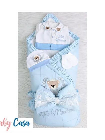 The "Little Munchkin" combo set in blue and white. This complete package includes a personalized wrap, a two tone romper, and a matching cap and mittens with a teddy bear theme.