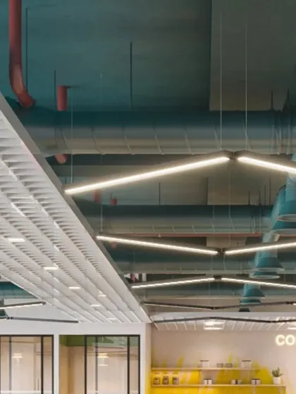 Another angle of the exposed ceiling, showing the integration of linear lighting within the complex network of HVAC ducts. This requires careful planning during the design and execution phases.
