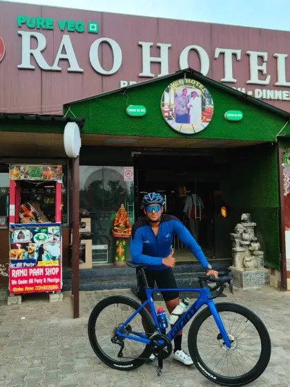 Another rider posing with his performance road bike at the Manesar ride destination. Our group welcomes all types of cycles, from hybrids to high-end road bikes.