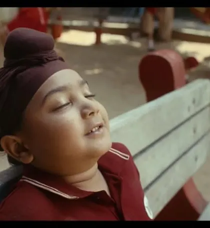 A beautiful, candid moment from the Zomato film. The little boy's school uniform, complete with a turban, was styled to look natural and lived-in.
