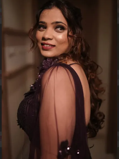 A beautiful close-up of the sangeet glam. The focus is on her glowing skin and a warm, smokey eye that makes her look absolutely captivating.