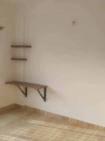 A room with freshly painted walls, ready for furniture. The clean paint job provides a bright and airy feel to the space.