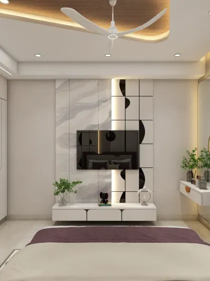 The TV unit in this bedroom is sleek and modern, with a floating dressing table beside it. The design is clean, functional, and saves space.