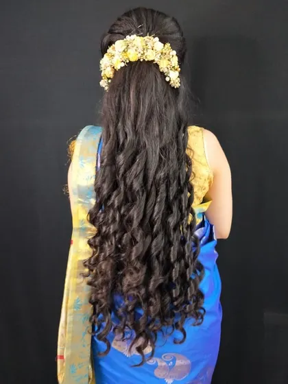 Long, flowing crimped curls for a dramatic effect. This hairstyle adds incredible volume and texture, perfect for a photoshoot or a grand event.