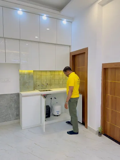 Even the space under the sink needs to be properly planned. Here I am checking the placement of the geyser and RO unit to ensure easy access for maintenance.