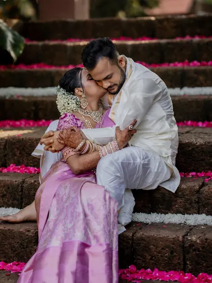 A playful and romantic moment on the steps of The Peacock Grove. We encourage our couples to be themselves, which allows us to capture their unique personalities and connection.