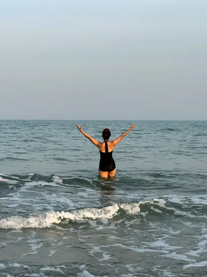 Embracing the vastness of the ocean. There is a powerful sense of freedom and surrender that comes from standing in the sea, letting the waves wash over you.
