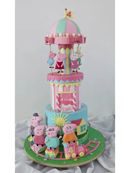 The full, three-tiered Peppa Pig cake, combining a carousel, a train, and the iconic house on the hill.