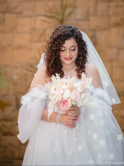 Another beautiful shot of the bride and her pampas grass bouquet. The textures in her hair and bouquet complement each other perfectly.