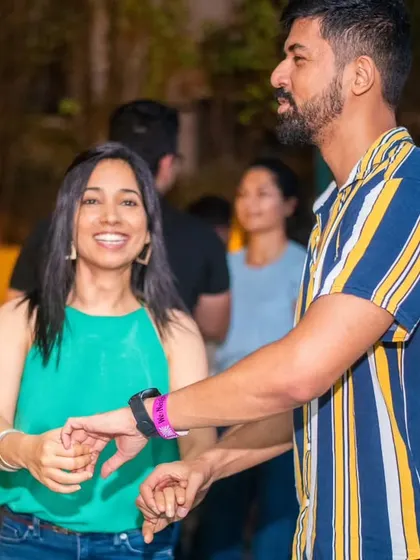 A happy and relaxed couple. The striped shirt and green top are a great color combination.