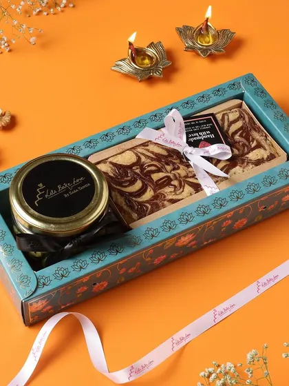 A stylish and modern Diwali gift box containing a tea cake and a jar of my gourmet treats.
