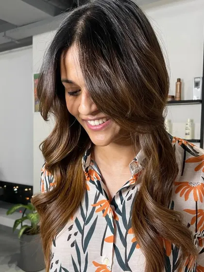 A candid shot of the client, her smile as bright as her hair.