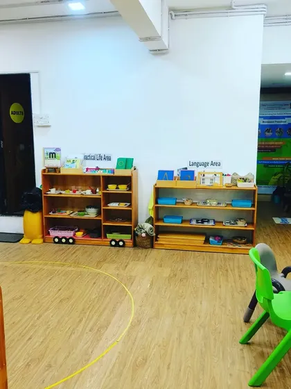 I can turn any space, like this Practical Life and Language Area, into a playground for learning and movement. My equipment is portable and safe, allowing me to set up a fun and effective fitness session anywhere.