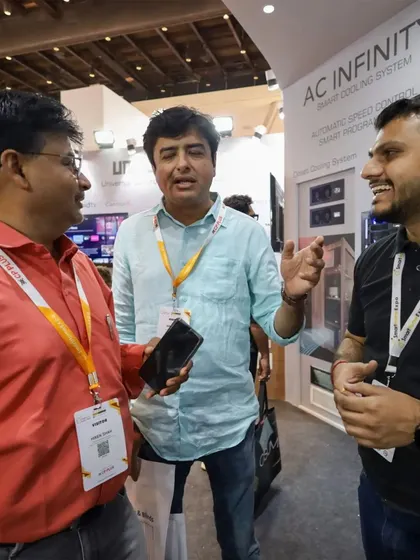 Engaging conversations are what drive innovation. Our team members are pictured here at the Smart Home Expo 2024, discussing our comprehensive home automation and power stabilization products with an interested visitor.