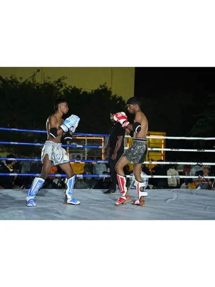 A repeat of the technical exchange between two fighters, showcasing their stance and readiness during a state level competition.