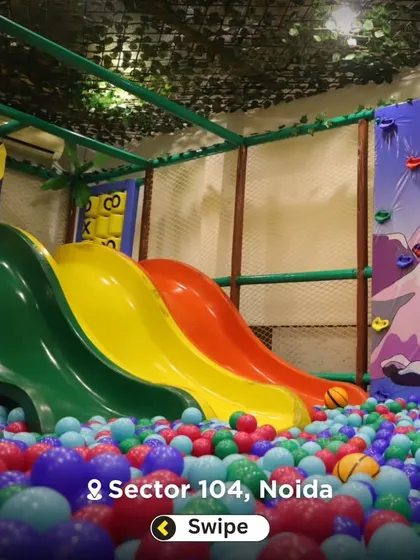 Another look at our multi-colored slides and ball pit combination. This area is designed for high-energy fun and is a favorite among our young visitors.