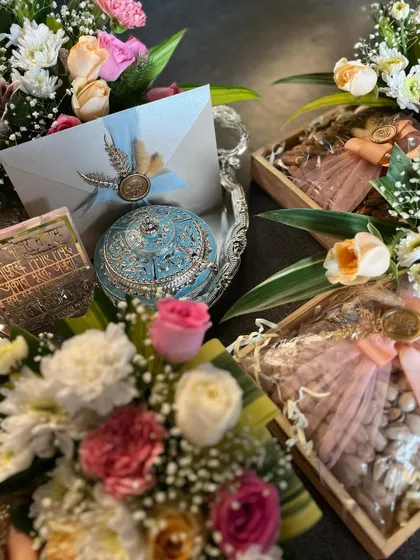 A complete view of the Samdhi invitation set, combining a floral dry fruit tray with a decorative silver platter. The turquoise and silver elements add a touch of shahi elegance.