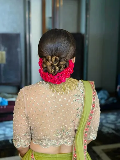 Another angle of the stunning floral rose bun, showcasing its flawless finish and structure.