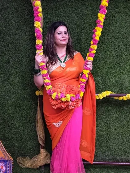 Another happy member posing on the floral swing during our Teej party.