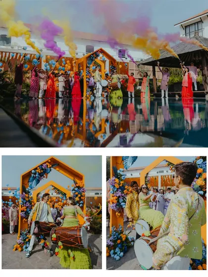 The couple's grand entrance to their poolside Haldi party, complete with dhol players and colorful smoke bombs.