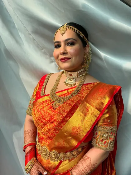 The bride's vibrant energy and happy aura are captured in this beautiful shot. The makeup enhances her natural glow and complements her personality.