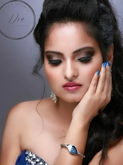 Another take on the classy cocktail look, showing the sparkle and shine of the makeup. The smoky eye is paired with a soft, glossy lip to balance the drama.