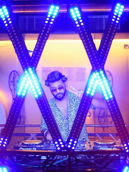 A wider shot of me framed by the lights. The visual setup is a big part of the experience I provide.
