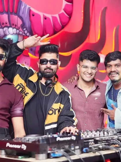 All smiles with the boys at the DJ booth.