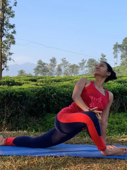 A revolved lunge provides a gentle twist for the spine while also opening the hips. Practicing these poses in nature enhances the feeling of release and connection to the body.
