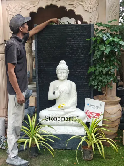 To give a sense of scale, one of my team members stands beside the 5-foot Blessing Buddha fountain. This demonstrates the impressive size and craftsmanship of the piece.