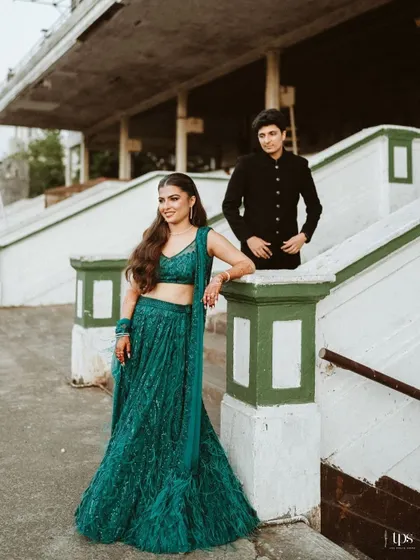 A portrait that blends modern style with classic romance. We use the architectural elements of a venue like the Mahalaxmi Racecourse to frame our couples, creating editorial shots that are both elegant and full of personality.