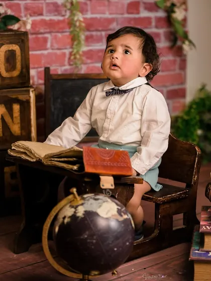 A gallery of our popular school and library theme. These images show the versatility of the brick wall backdrop, mini school desk, globe, and book props for creating a variety of scholarly and classic portraits.