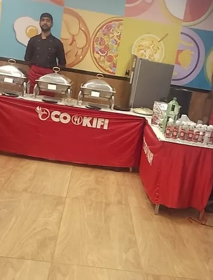 A complete buffet setup in the colorful cafeteria of Ninjacart, ready for their Deepavali office party.