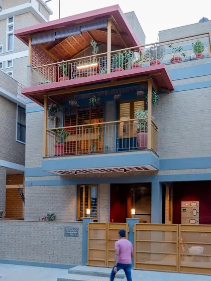 The front elevation of the house, showing the layered balconies.