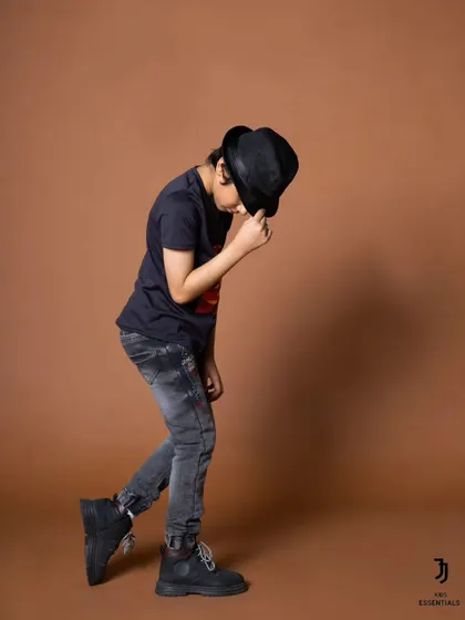 A Michael Jackson inspired pose from the same shoot. Using creative and fun poses makes the session enjoyable for the child model and results in unique photos.