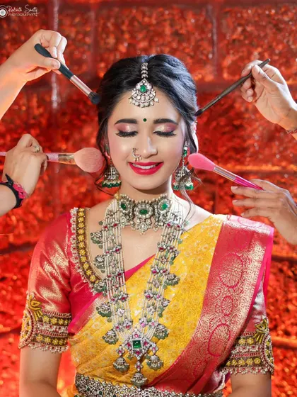 I love capturing the energy behind the scenes. This shot of a bride getting her final makeup touches is full of life and shows the artistry that goes into creating the perfect bridal look.