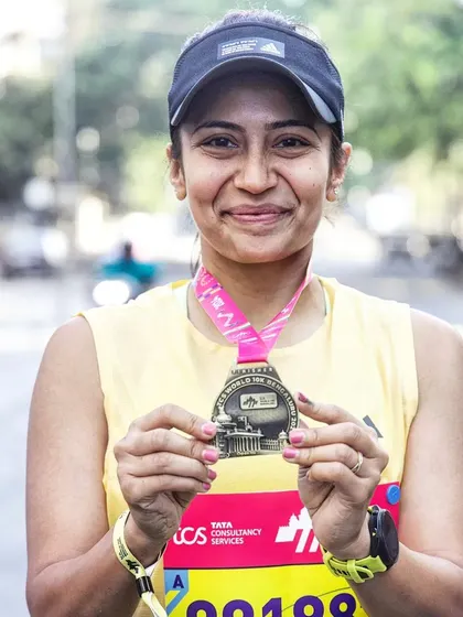 A duplicate of image 33. That post-race glow after the TCS10K. This medal represents more than just a run; it's a story of overcoming personal adversity.