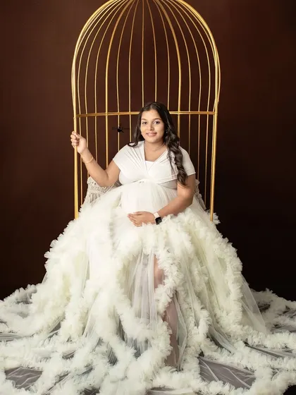 A beautiful full-length shot featuring our popular golden birdcage swing. It creates a lovely frame for a portrait and adds a fairytale quality to the photos.