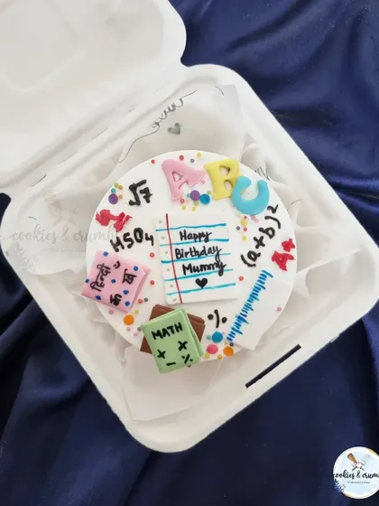 Another version of my teacher-themed bento cake. This one was for a mom who is a teacher, with all the little school-related details made from fondant.