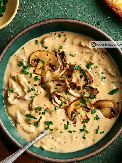 This is our rich and earthy Cream of Mushroom soup, made with fresh mushrooms and garnished with parsley. It's a sophisticated choice for any formal dinner.
